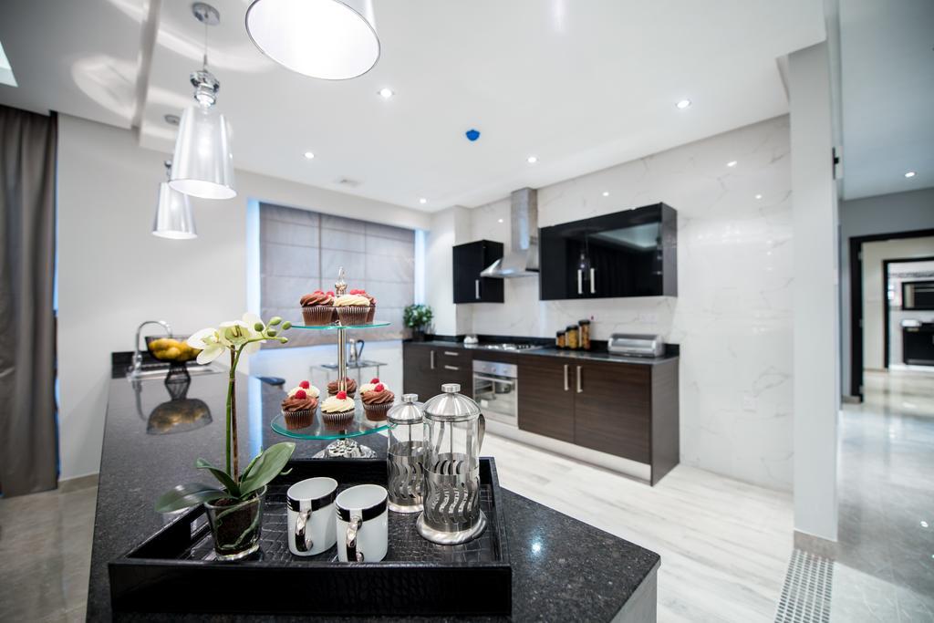 Al Manzil Residence Манама Стая снимка